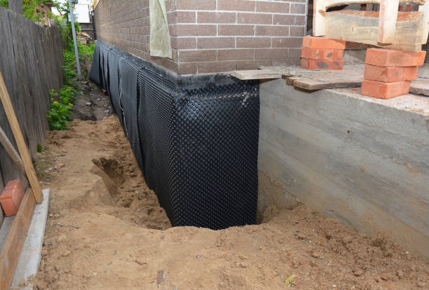 Happy homeowners after waterproofing job in Killbuck